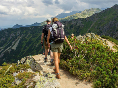 couple hiking along a path
