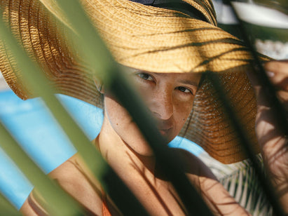 woman wearing a sun hat outside
