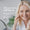 A smiling mature woman applies Age Defy+ Hydra-Glow Night Cream to her cheek.